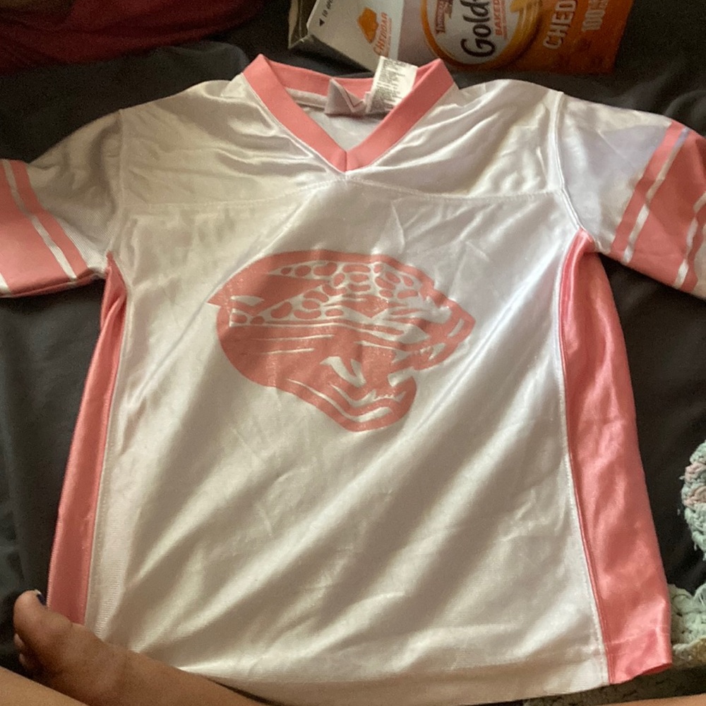 Brand:NFL Size: Medium (7-8) Color: White and pink